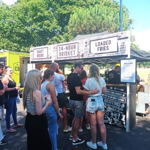 Crowds at Need St stall Southsea Food Festival 24